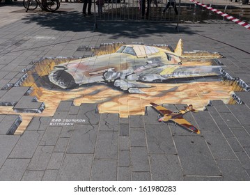 ALMERE, NETHERLANDS - JUNE 30: Street art showing the power of 3D optical illusion during the annual Street Art Festival held in the streets of the city of Almere on June 30, 2013