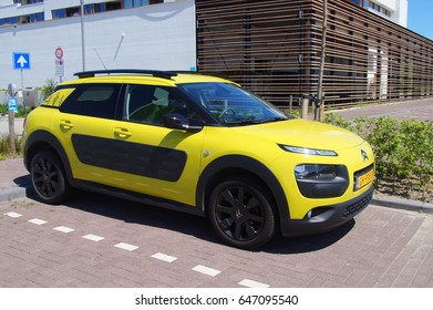 Almere, The Netherlands - May 25, 2017: Yellow Citroën C4 Cactus Parked In A Public Parking Lot In The City Of Almere.  