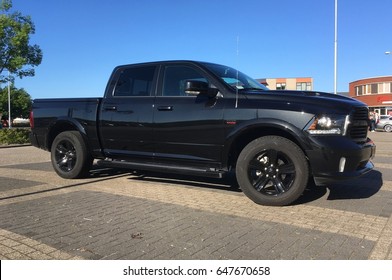 Almere, the Netherlands - May 25, 2017: Black Dodge Ram pick up parked in a public parking lot in the city of Almere. 