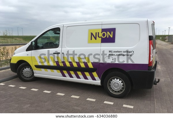 Almere, The\
Netherlands - May 5, 2017: Nuon  Energy service car parked in a\
public parking lot. Nobody in the\
vehicle.
