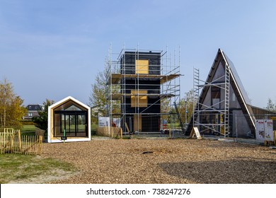 Almere, Netherlands, October 2017. Building site with three so called tiny houses under construction