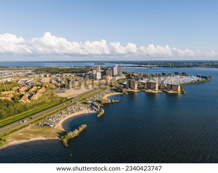 Almere Poort marina and the new residential neighbourhood with highrise apartment buildings in Almere, Flevoland, The Netherlands