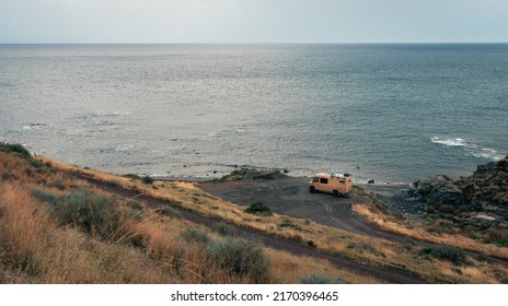 Almeria, Spain 06 21 22.
Camper Van  Parked On The Beach At Sunset. Van Life 