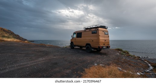 Almeria, Spain 06 21 22.
Camper Van  Parked On The Beach At Sunset. Van Life 