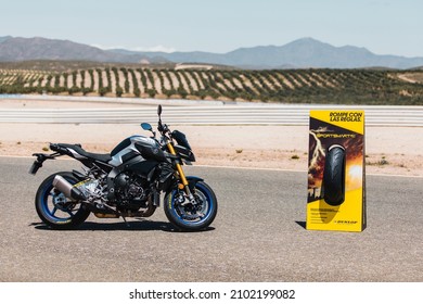 Almeria, Spain - May 4th 2021: A blue Yamaha sport motorbike and Dunlop sportsmart tyres advertisement totem on the circuit finish line, during Dunlop Xperience showroom and test in Almeria, Spain.