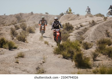 Almeria, Spain - May 5th 2021: Motocross Riders Riding Downhill In Tabernas Desert During Dunlop Xperience Showroom And Test In Almeria, Spain.