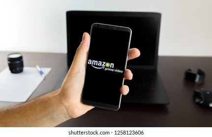 Almeria, Spain - November 11, 2018: Holding A LG G6 Android Smartphone On Hand With A Amazon Prime Video PNG Logo Image On Screen Opened From The Gallery App On The Phone Covering The Front Display