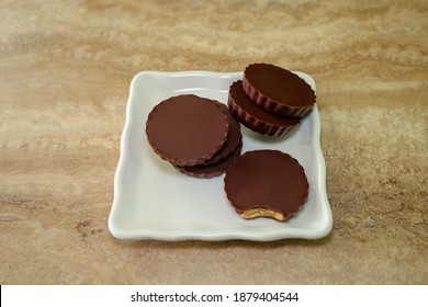 Almond Butter Chocolate Cups On A White Plate.