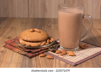 Almond Cake, Almonds And A Mug With Milk Chocolate