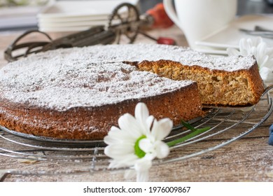 Almond cake gluten free and fresh baked served on a rustic wooden table background