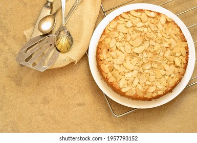 Almond cake with prunes. Bakewell tart,  top view, copy space