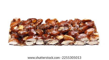 Almond caramelized bar nut, candied isolated on white, side view