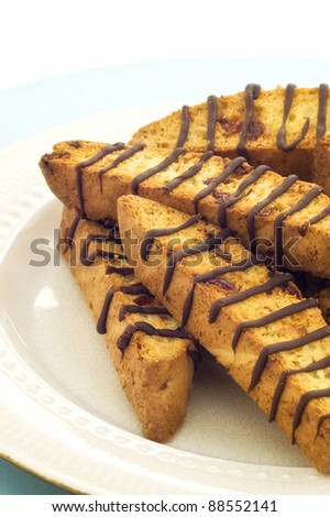 Almond Cranberry Biscotti with drizzled chocolate in vertical format