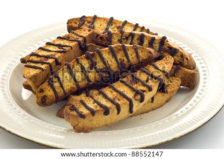 Almond Cranberry Biscotti with drizzled chocolate on white plate
