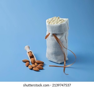 Almond Flour, Bag Of Nut Flour On Blue Background