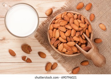 Almond Milk In A Glass And Almonds In A Bowl On Light Wooden Background. Top View