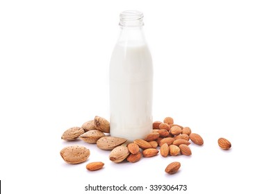 Almond Milk And Almond Seeds Over White Background