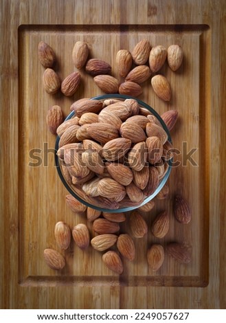 Similar – Image, Stock Photo Wooden background with almonds and chia seeds