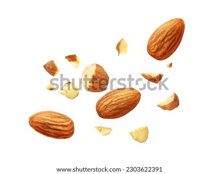Almond nuts isolated on white background. Almond fly. Full depth of field. Close up view.