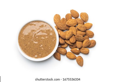 Almond spread. Almonds and butter isolated on white background.