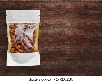 Almond Window Pouch Packaging Isolated On Wood Background.