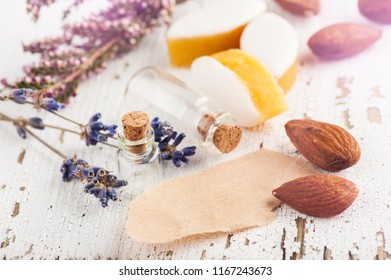 Almonds and calissons with rustic decor, lavender flowers on wooden table