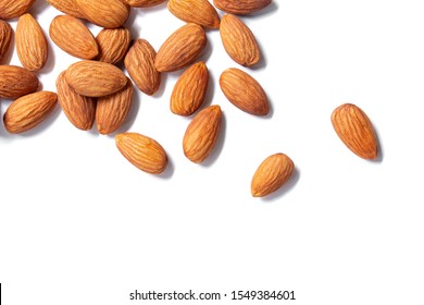 Almonds floating pieces on white isolated .almond  Image stack Full depth of field macro shot  