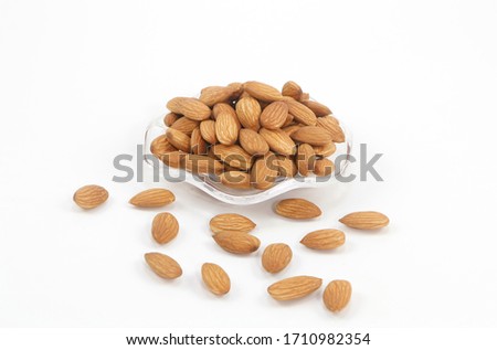 Almonds isolate on white background almonds are also called as Badam in India and is good source of proteins
