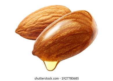 Almonds with oil drop isolated on white background 