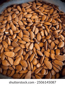 Almonds pakistani premium photo almond texture its called local badam stock photo dry fruit best for brain lots raw almonds top view backgrounnd stock photo 