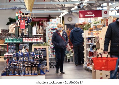 Almondsbury, England-November 21,2020: A Woman Does Her Christmas Shopping While Wearing Her Mask