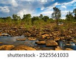 The almost dried-up Mary River, close to the Great Northern Highway Bridge between Fitzroy Crossing and Halls Creek, Western Australia. Sandstone boulders, pools and small trees
