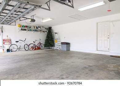 An almost empty garage to be used as storage for junk that will be collected over the years