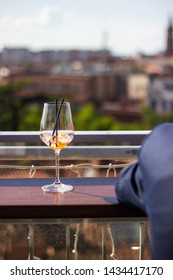 Almost Empty Glass At A Rooftop Bar In France