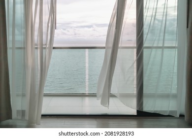 Almost Evening Time Of Ocean View From Hotel Balcony With Curtains.