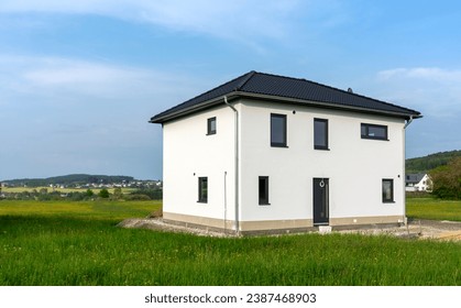 Almost finished prefabricated house in green nature in German rural region - Powered by Shutterstock