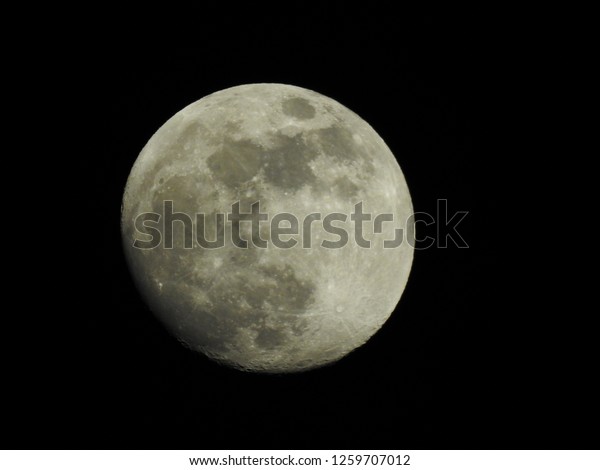 Almost full moon / The Moon is an astronomical
body that orbits planet Earth and is Earth's only permanent natural
satellite. It is the fifth-largest natural satellite in the Solar
System