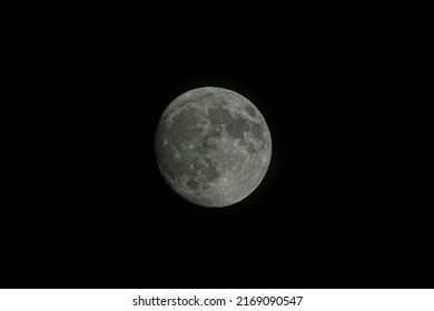 Almost Full Moon In Close Up Against Completely Black Background