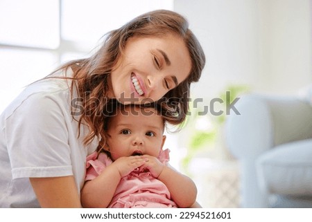 Its almost time for her nap. Shot of a mother and child bonding at home.