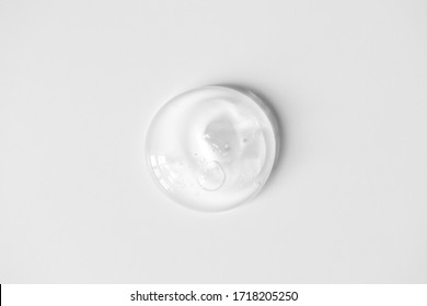 Aloe Gel Smudge With Air Bubbles On White Background. Pure Transparent Facial Cleanser, Peeling, Shampoo Or Shower Gel, Top View