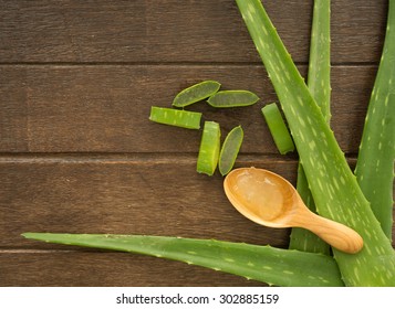 Aloe Vera  With Aloe Vera Gel On Wooden Table. Top View