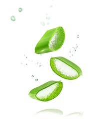 Aloe Vera Isolated On White Background. Leaf Of Aloe Vera Plant And Drops Of Juice Or Gel.