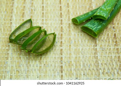 Aloe Vera Leaf And Slice On Wooden Background, Fresh Aloe Vera Is Natural Remedy For Sunburn Relief And Cure Many Things.