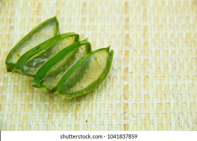 Aloe Vera Leaf And Slice On Wooden Background, Fresh Aloe Vera Is Natural Remedy For Sunburn Relief And Cure Many Things.