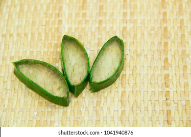 Aloe Vera Leaf And Slice On Wooden Background, Fresh Aloe Vera Is Natural Remedy For Sunburn Relief And Cure Many Things.