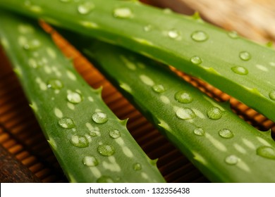 Aloe Vera Leaves On Wooden Background, Close Up