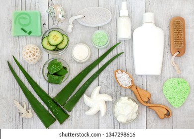 Aloe vera skin care including plant stems, cucumber, yoghurt, moisturiser, facial cream, body lotion and exfoliating salt scrub. Health concept beneficial for sunburn, psoriasis, eczema and acne.   - Powered by Shutterstock