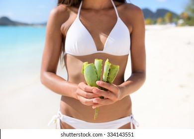 Aloe Vera - Woman Showing Plant For Skin Care Treatment Using Aloes. Can Be Used As Natural Medicine Or Remedy Against Sunburn.