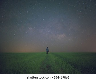 Alone boy with milky way in the background - Powered by Shutterstock