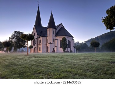 Alone Church At Dusk Wallpaper. Ancient Stone Church With Blue Evening Sky. Mystical Fog Background. 